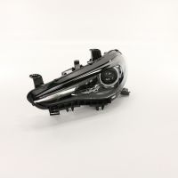 Främre vänster strålkastare med gasurladdningslampor